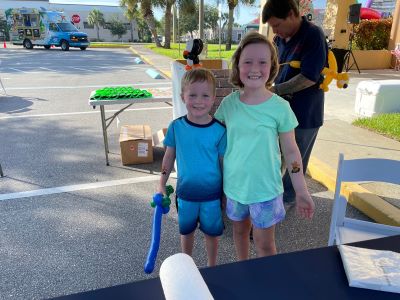 Two kids outside at an event