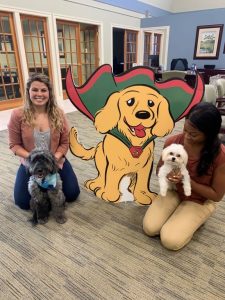 BayFirst employees and dogs posing with mascot